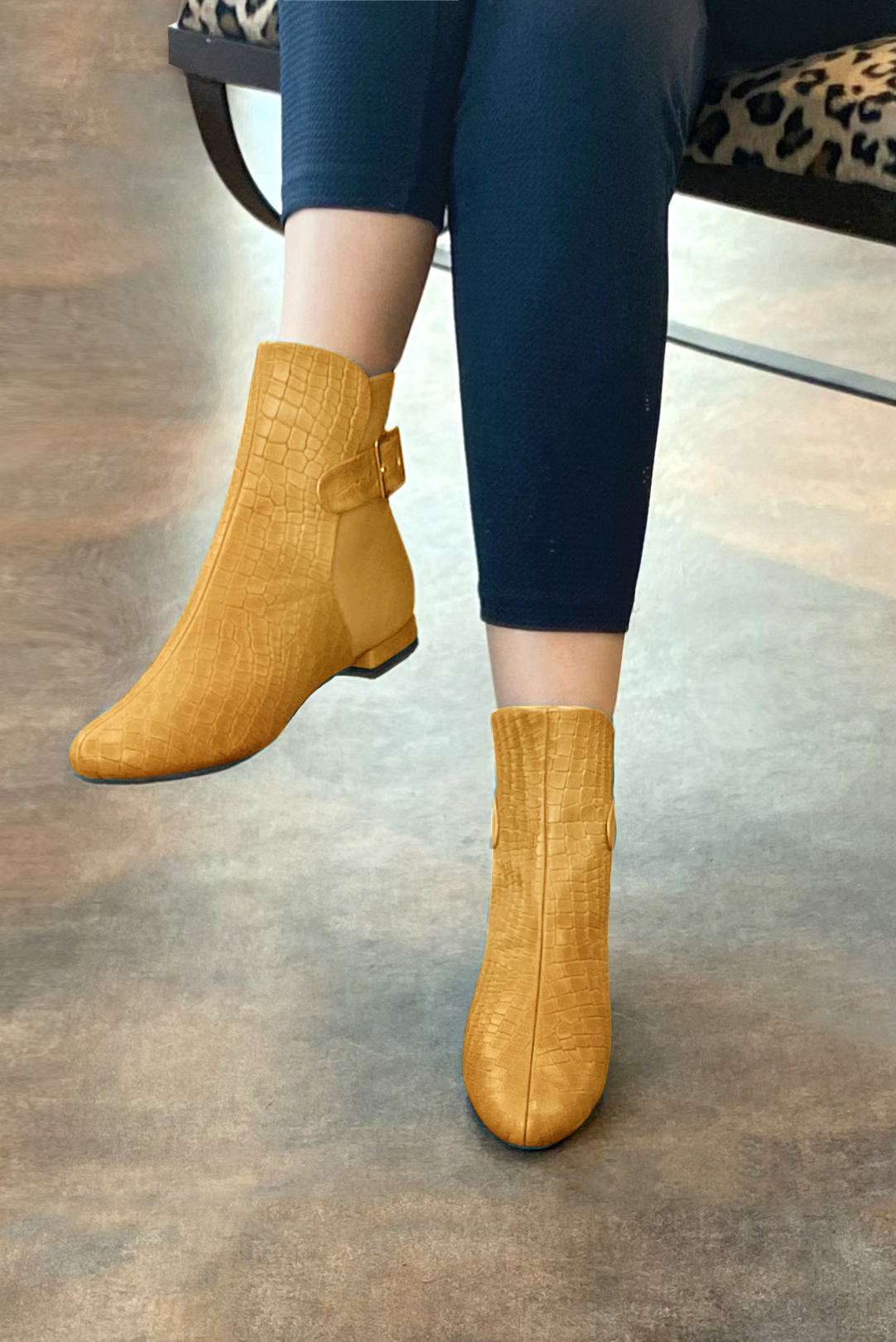 Mustard yellow women's ankle boots with buckles at the back. Round toe. Flat block heels. Worn view - Florence KOOIJMAN